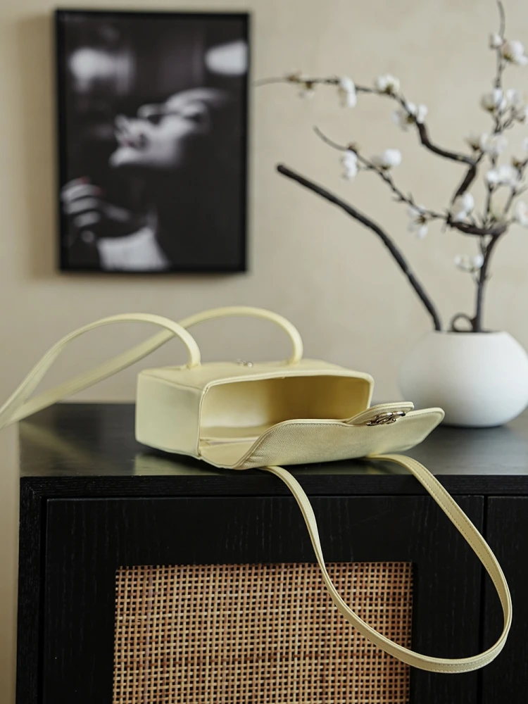 Front view of pale yellow 26C Jennie’s New Chanel Bag AP5248 Preppy Coco Chanel vintage shoulder bag with open top