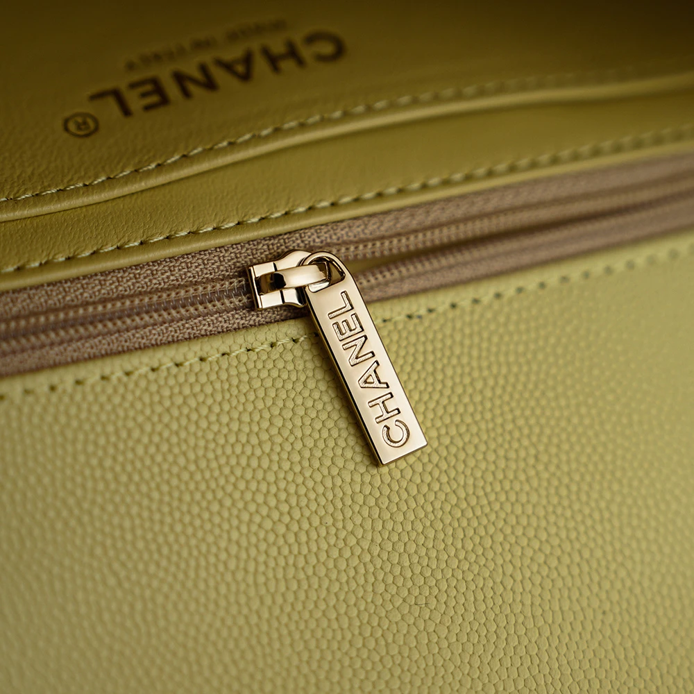 Close-up of Chanel zipper pull on 26C Jennie’s New Chanel Bag AP5248 Preppy Coco Chanel vintage shoulder bag