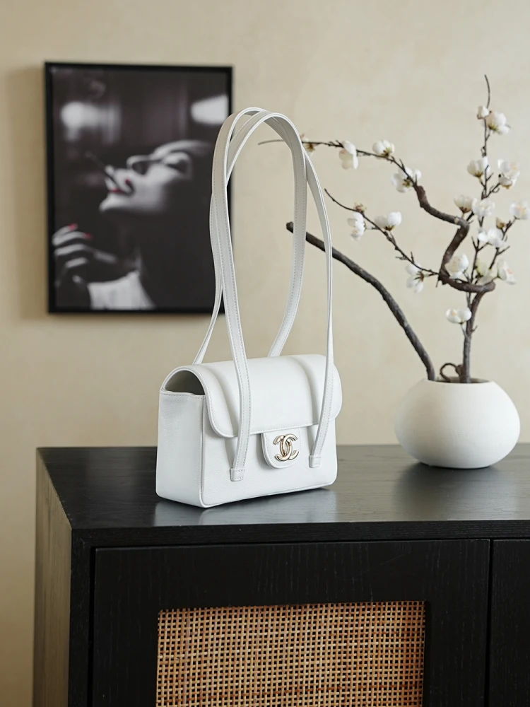 Front Left view of white 26C Jennie’s New Chanel Bag AP5248 Preppy Coco Chanel vintage shoulder bag with double C logo