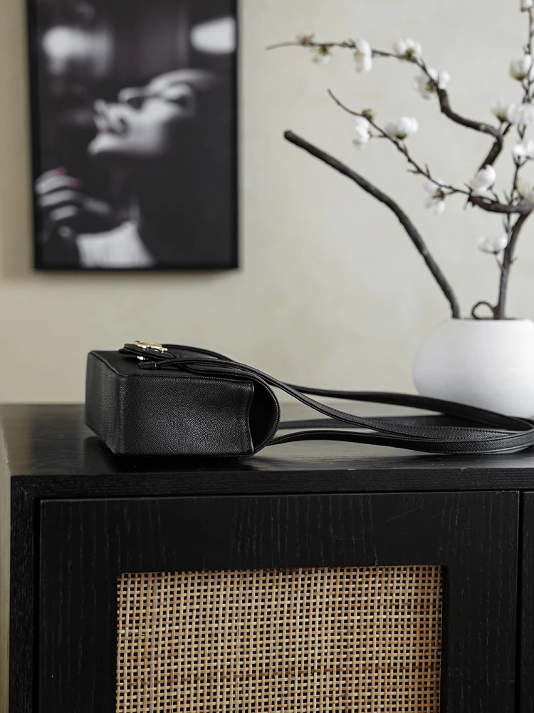 Side view of Chanel 26C AP5248 Jennie’s New Preppy Coco Chanel vintage shoulder bag in black with double C logo