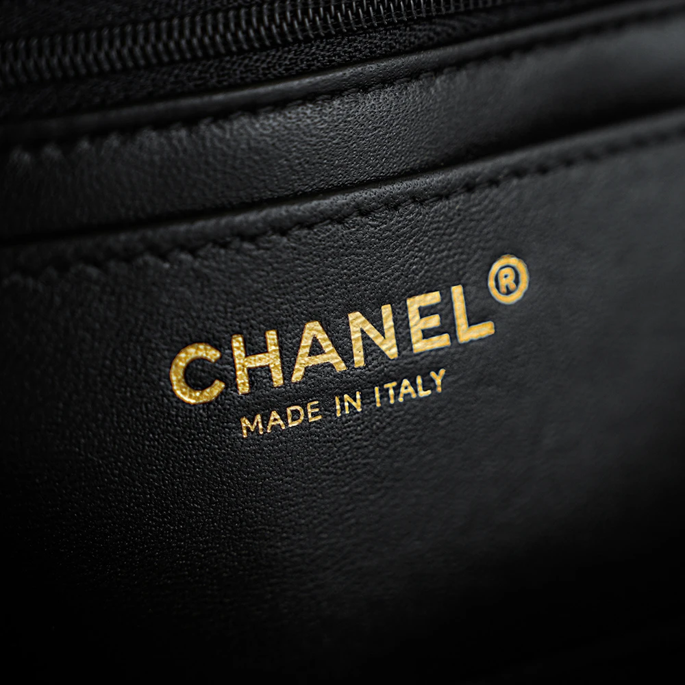 Close-up of Chanel "MADE IN ITALY" stamp on Chanel 26C AP5248 Jennie’s New Preppy Coco vintage shoulder bag in Black